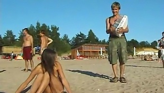 A Stunning Young Girl Enjoys Nude Beach Activities In Public