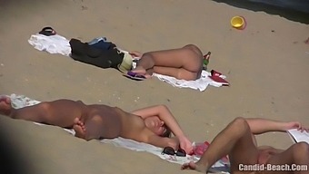 Uninhibited Couples Bask In The Sun And Explore Their Desires In Candid Nude Beach Footage